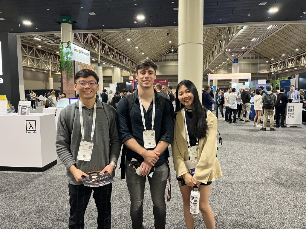 Research students Minh, Rey, and Judith at NeurIPS